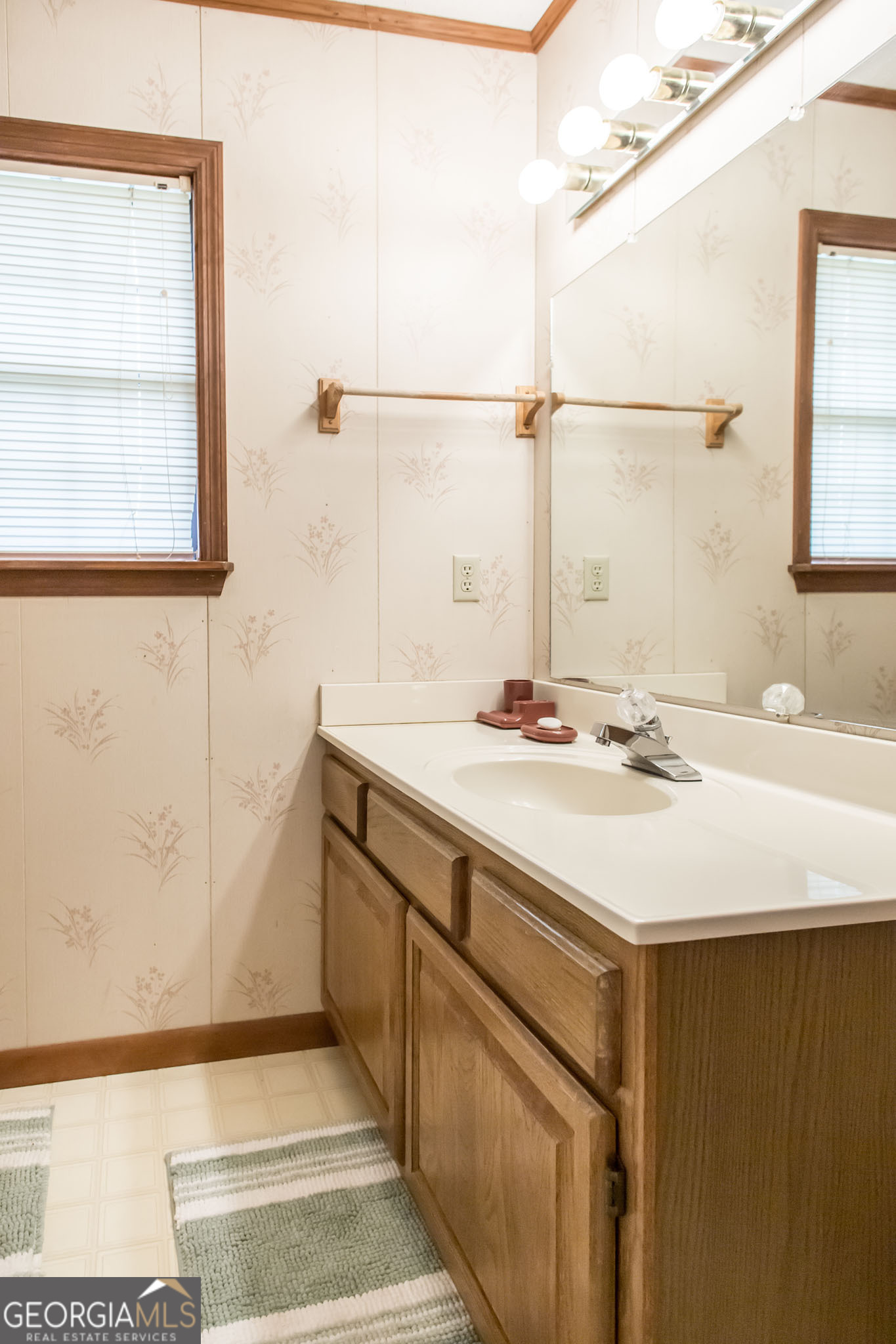 1917 Gilchrist Avenue Waycross, GA 31503 - Photo 25 of 42 a bathroom with a sink and a mirror