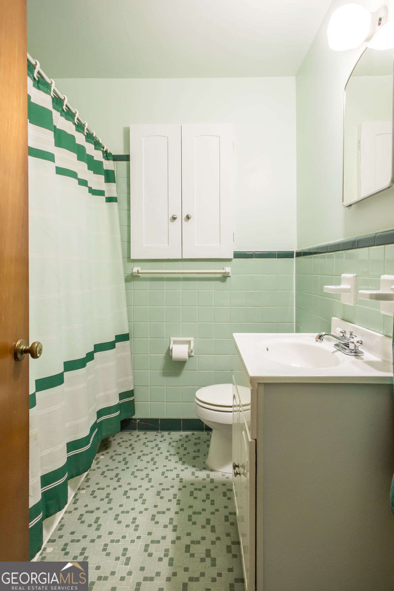 1917 Gilchrist Avenue Waycross, GA 31503 - Photo 28 of 42 a bathroom with a sink a toilet and a shower