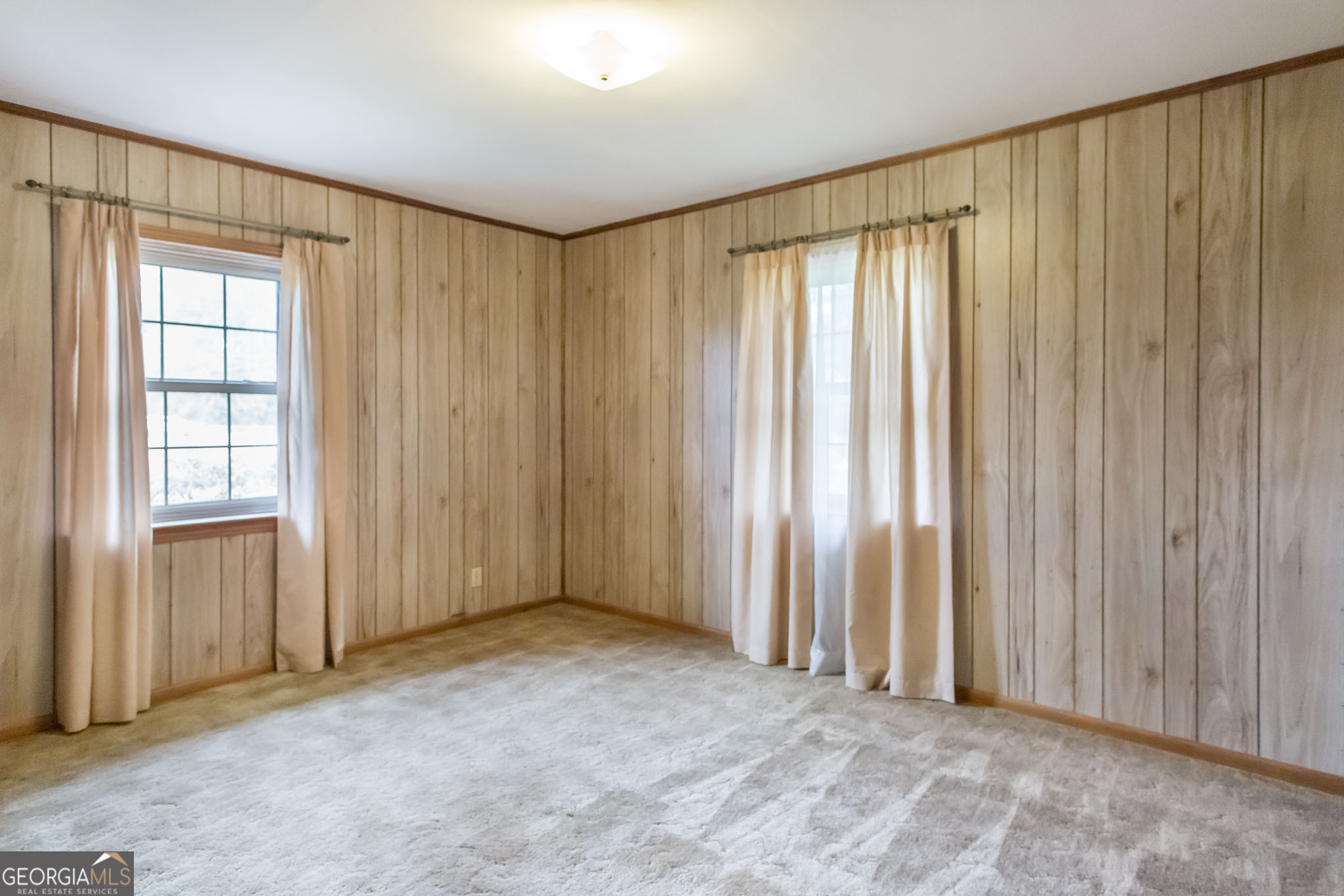 1917 Gilchrist Avenue Waycross, GA 31503 - Photo 34 of 42 an empty room with a window and a curtain