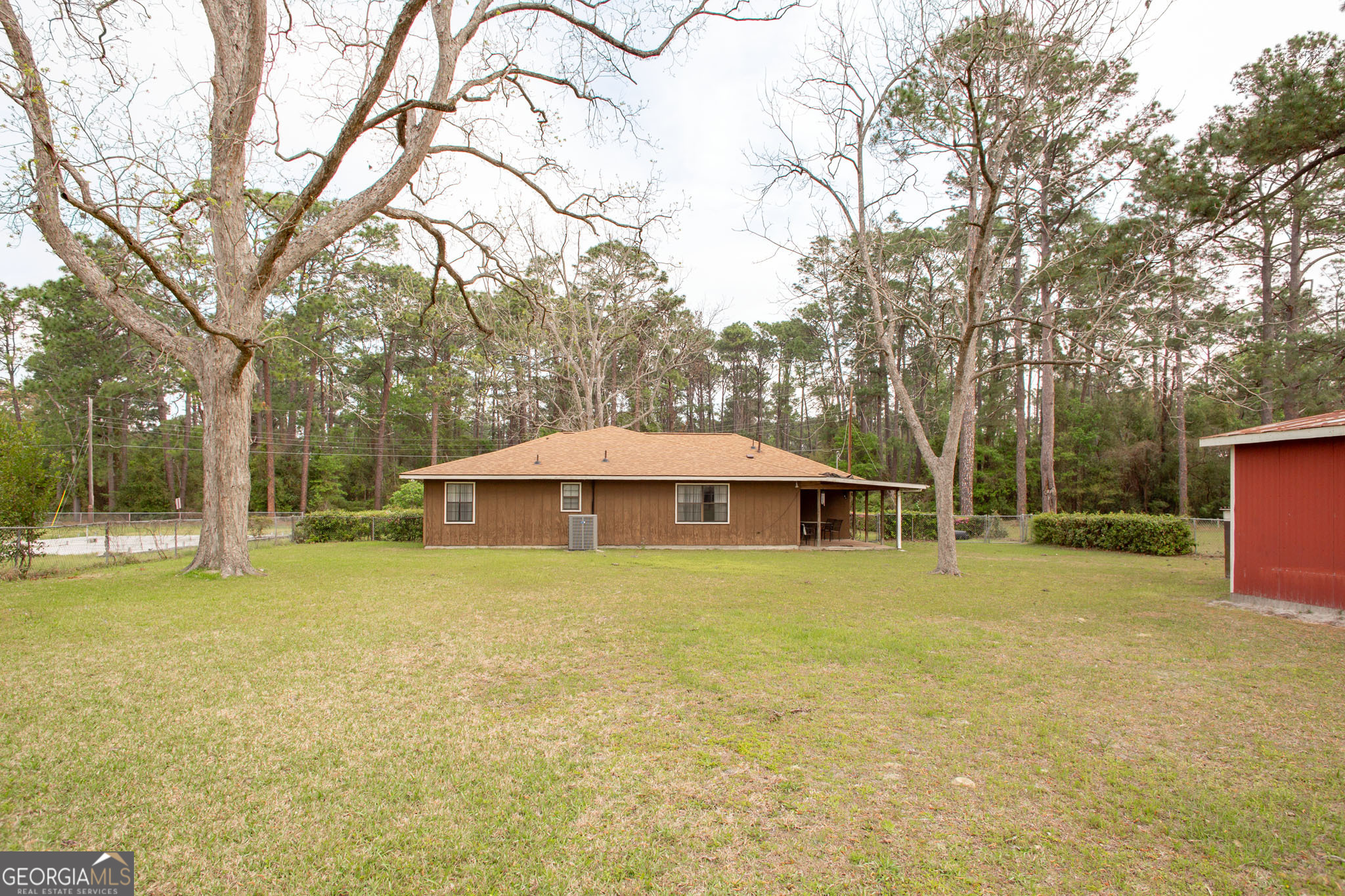 1917 Gilchrist Avenue Waycross, GA 31503 - Photo 39 of 42 a blue swimming pool is in a backyard of house