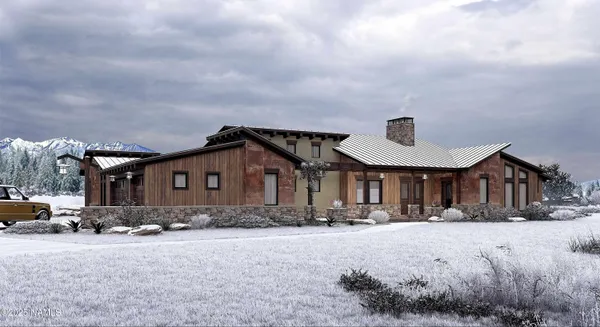 a front view of a house with a yard covered in snow
