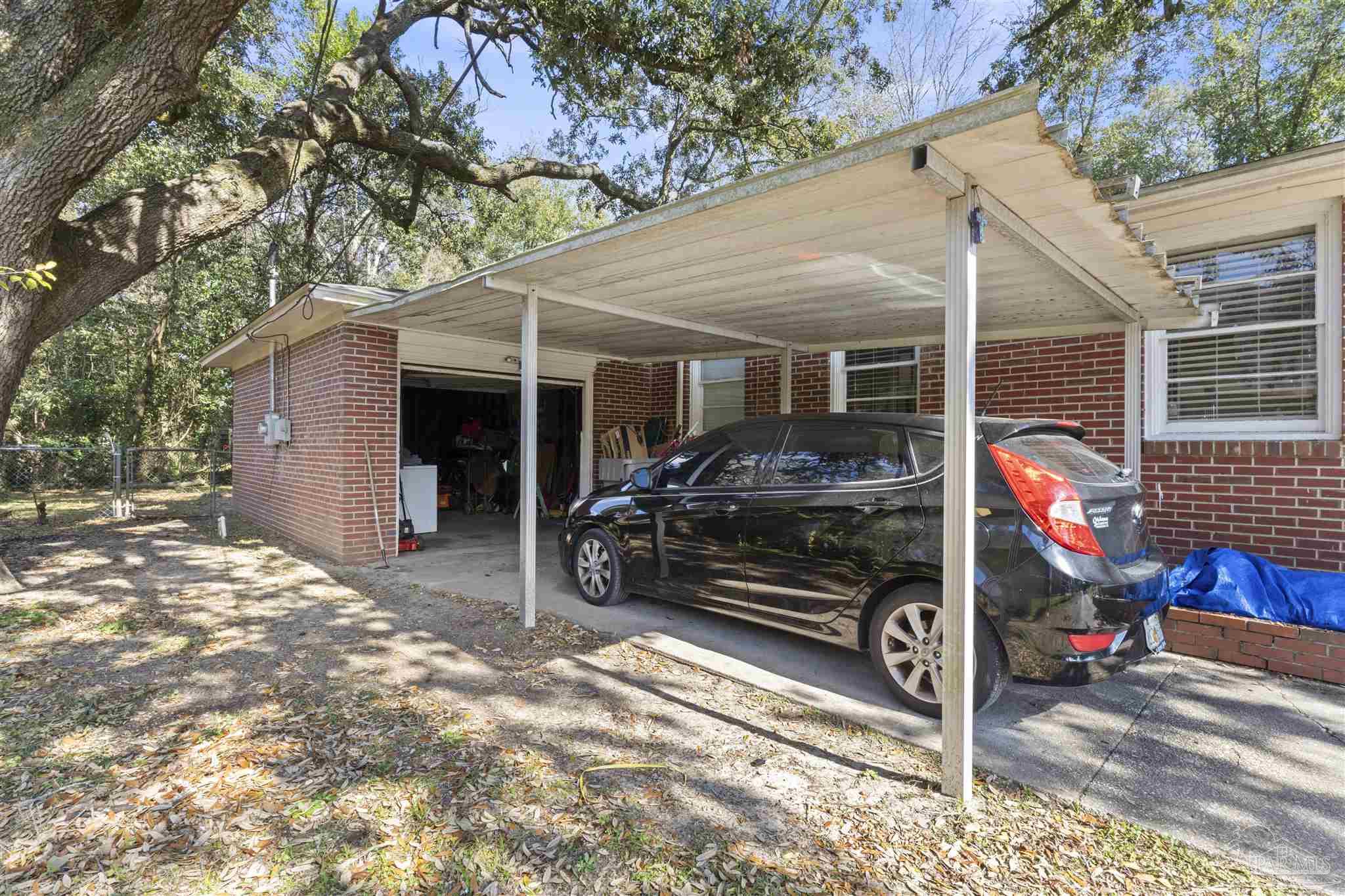 116 Rue Max Street Pensacola, FL 32507 - Photo 2 of 20 a view of a car park in front of house