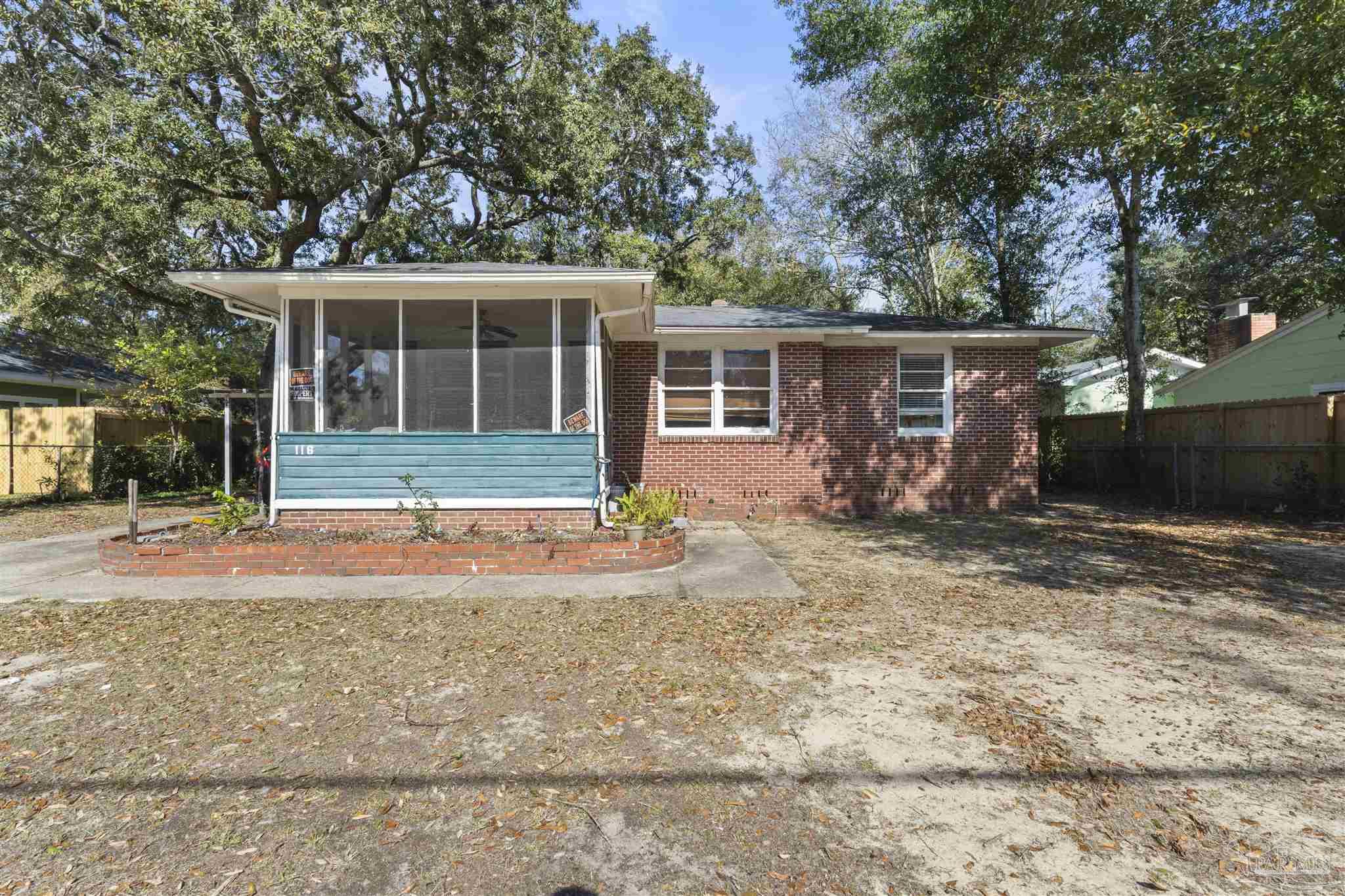 116 Rue Max Street Pensacola, FL 32507 - Photo 3 of 20 front view of a house with a yard