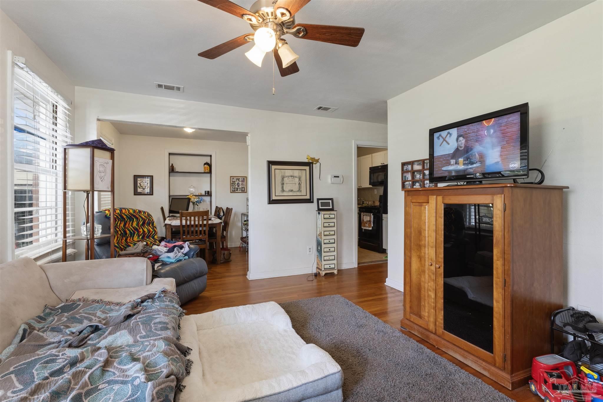 116 Rue Max Street Pensacola, FL 32507 - Photo 9 of 20 a living room with furniture and a flat screen tv