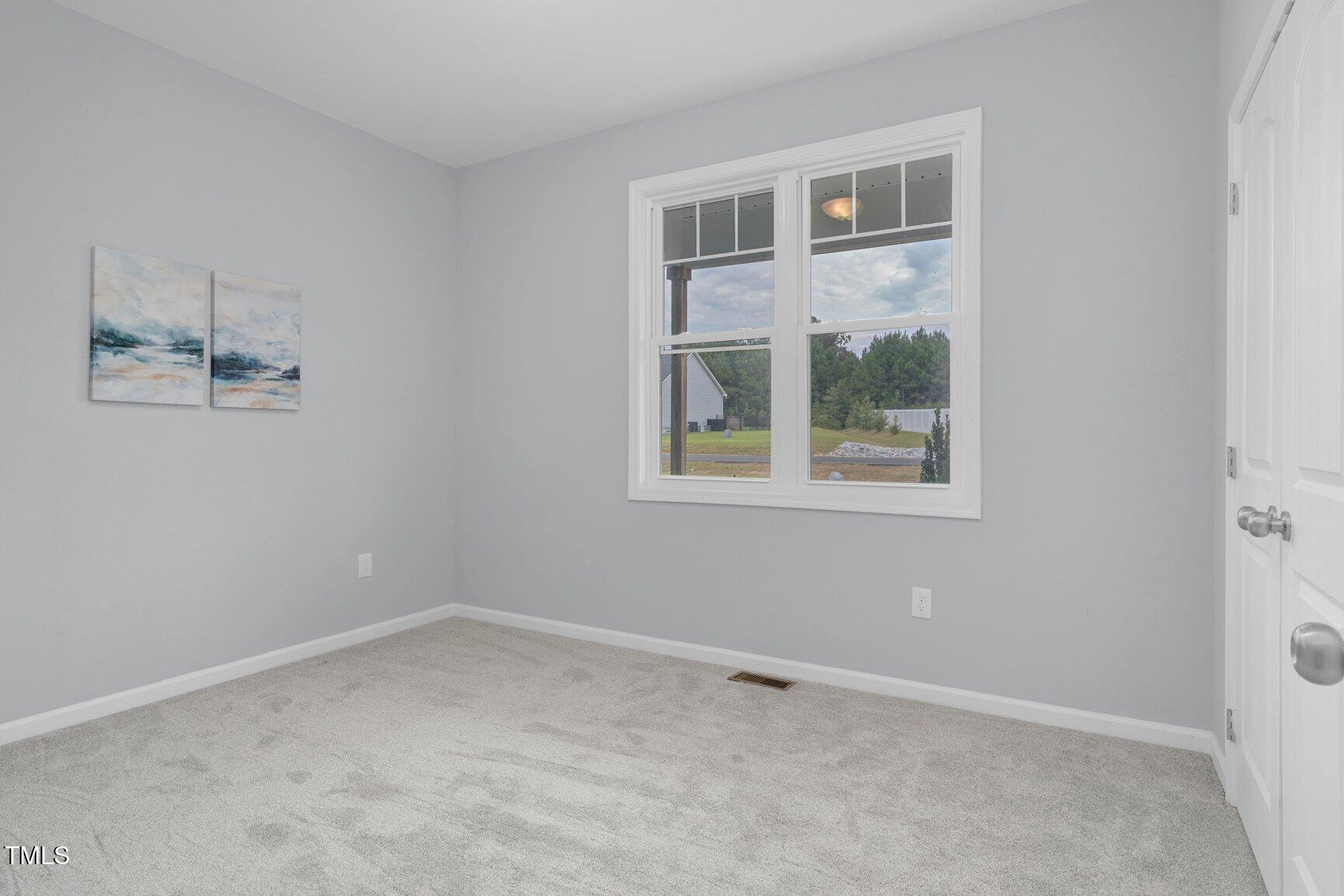 9506 South Beaver Crk Way Middlesex, NC 27557 - Photo 16 of 28 an empty room with a window