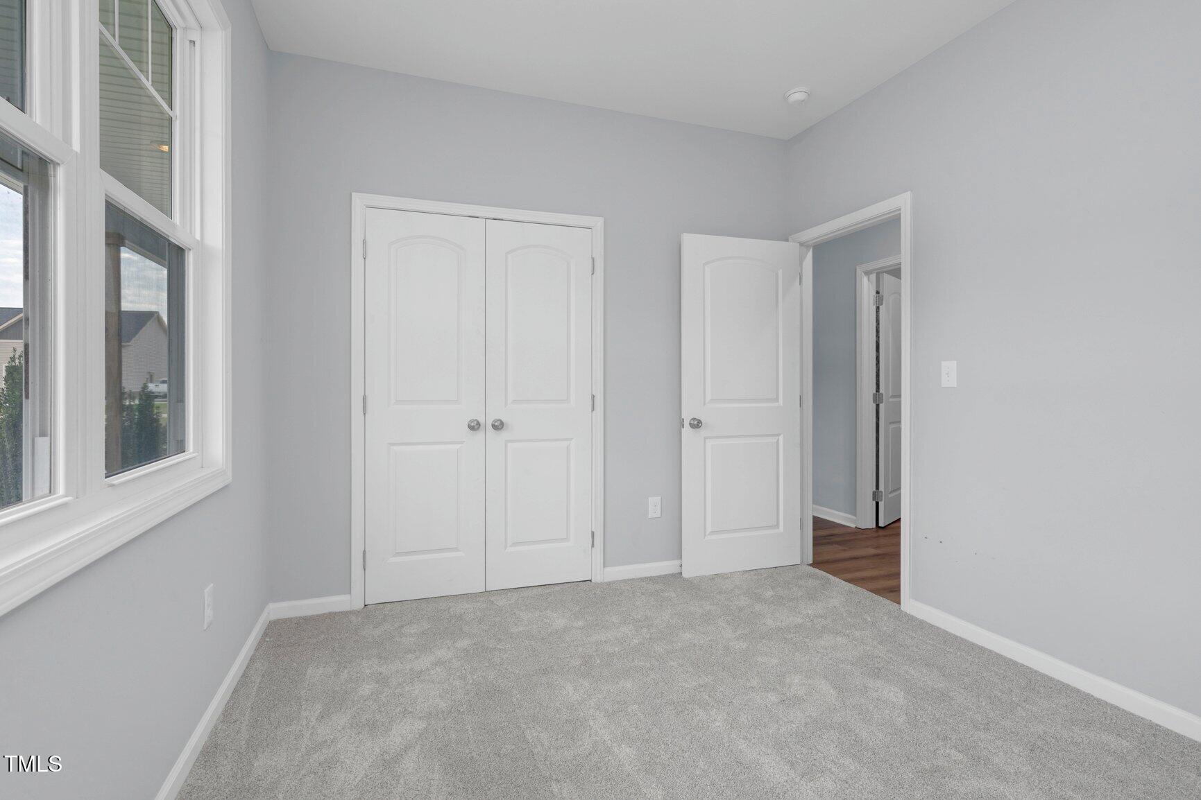 9506 South Beaver Crk Way Middlesex, NC 27557 - Photo 17 of 28 a view of an empty room with a window