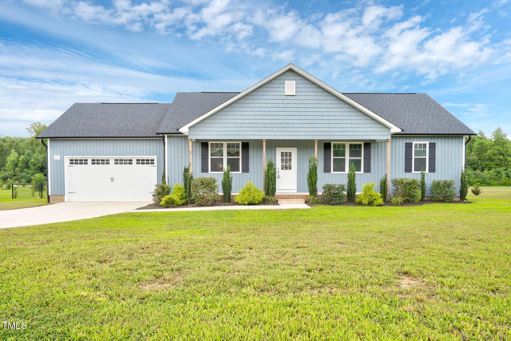 9506 South Beaver Crk Way Middlesex, NC 27557 - Photo 2 of 28 a front view of house with yard and porch