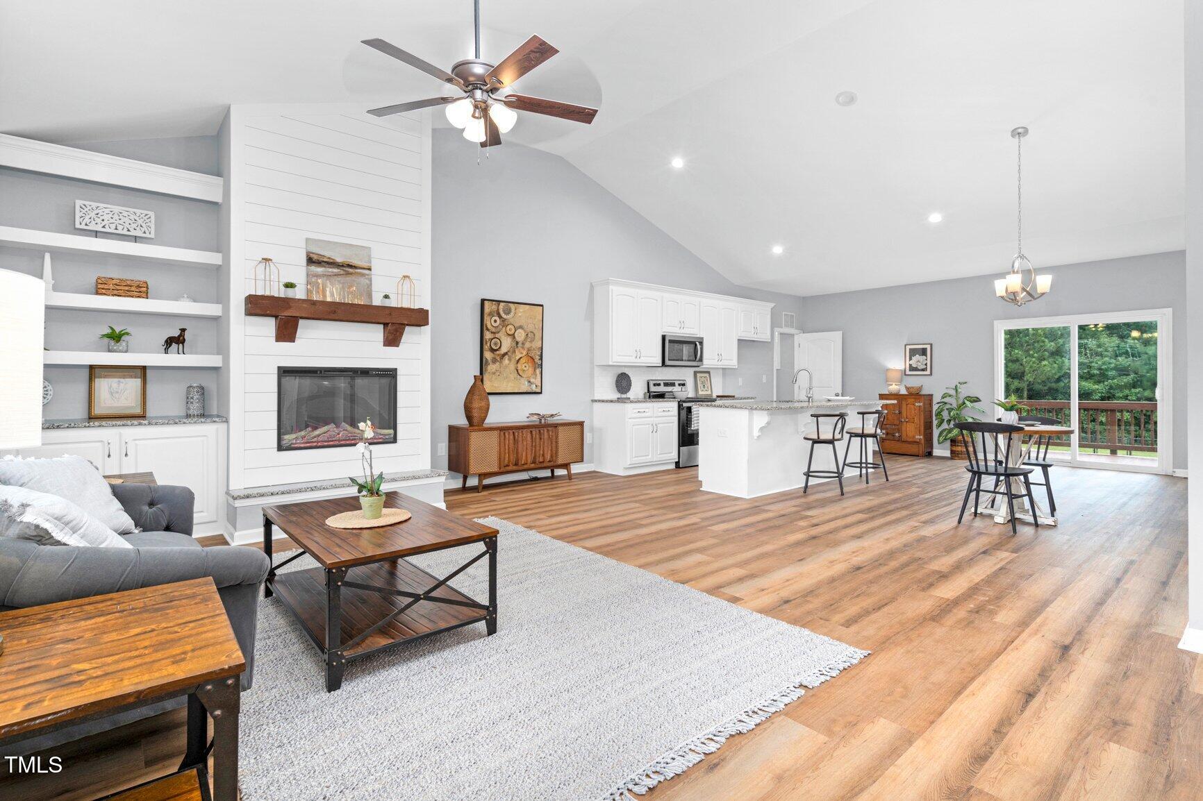 9506 South Beaver Crk Way Middlesex, NC 27557 - Photo 5 of 28 a living room with furniture and a fireplace