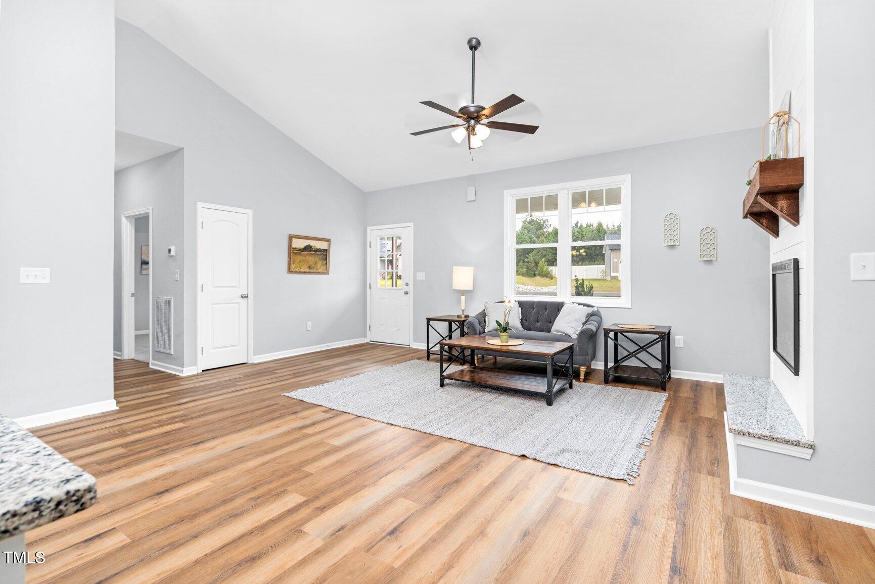 9506 South Beaver Crk Way Middlesex, NC 27557 - Photo 7 of 28 a living room with furniture and a wooden floor