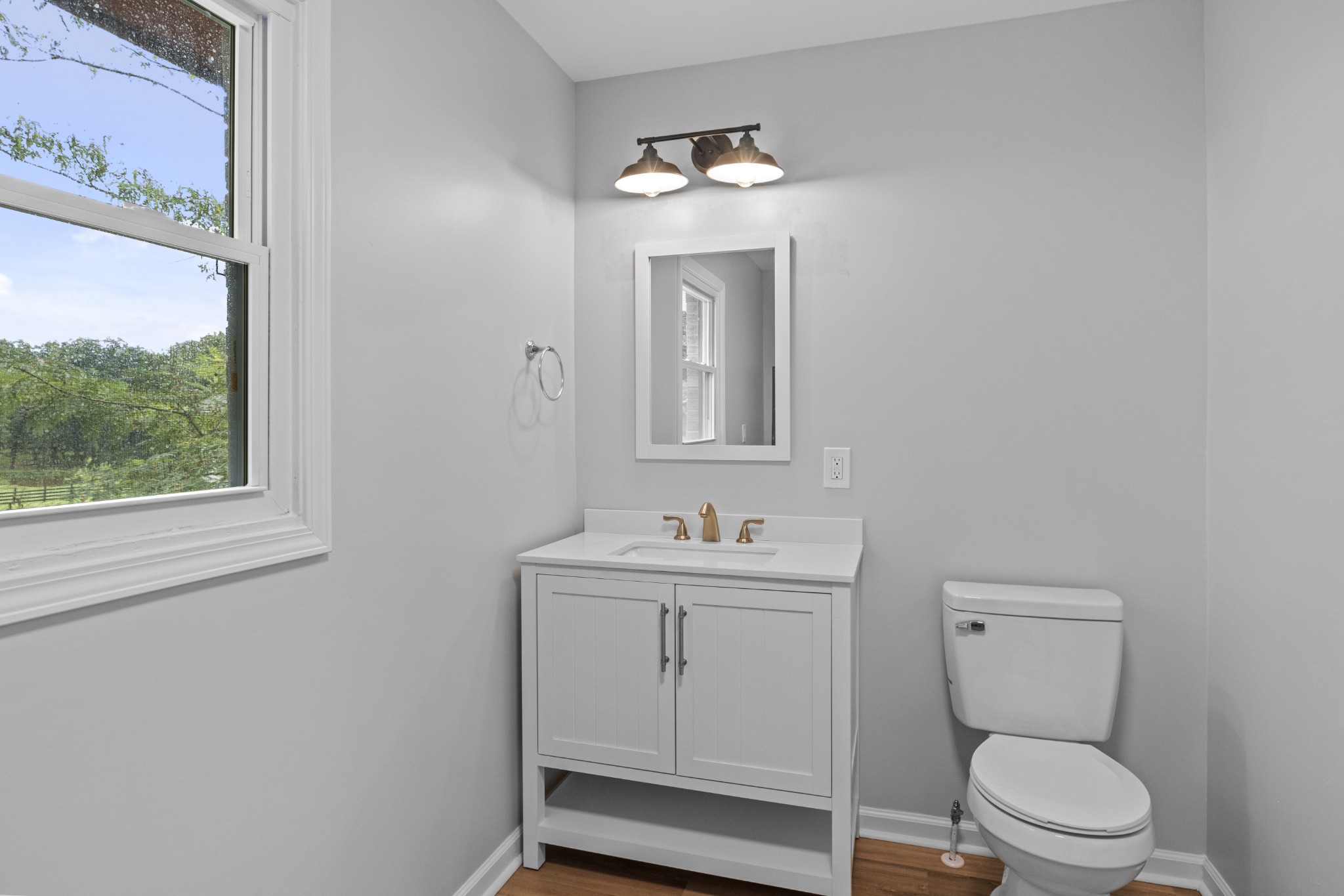 135 Hurricane Loop Tennessee Ridge, TN 37178 - Photo 14 of 29 a bathroom with a toilet a sink and mirror