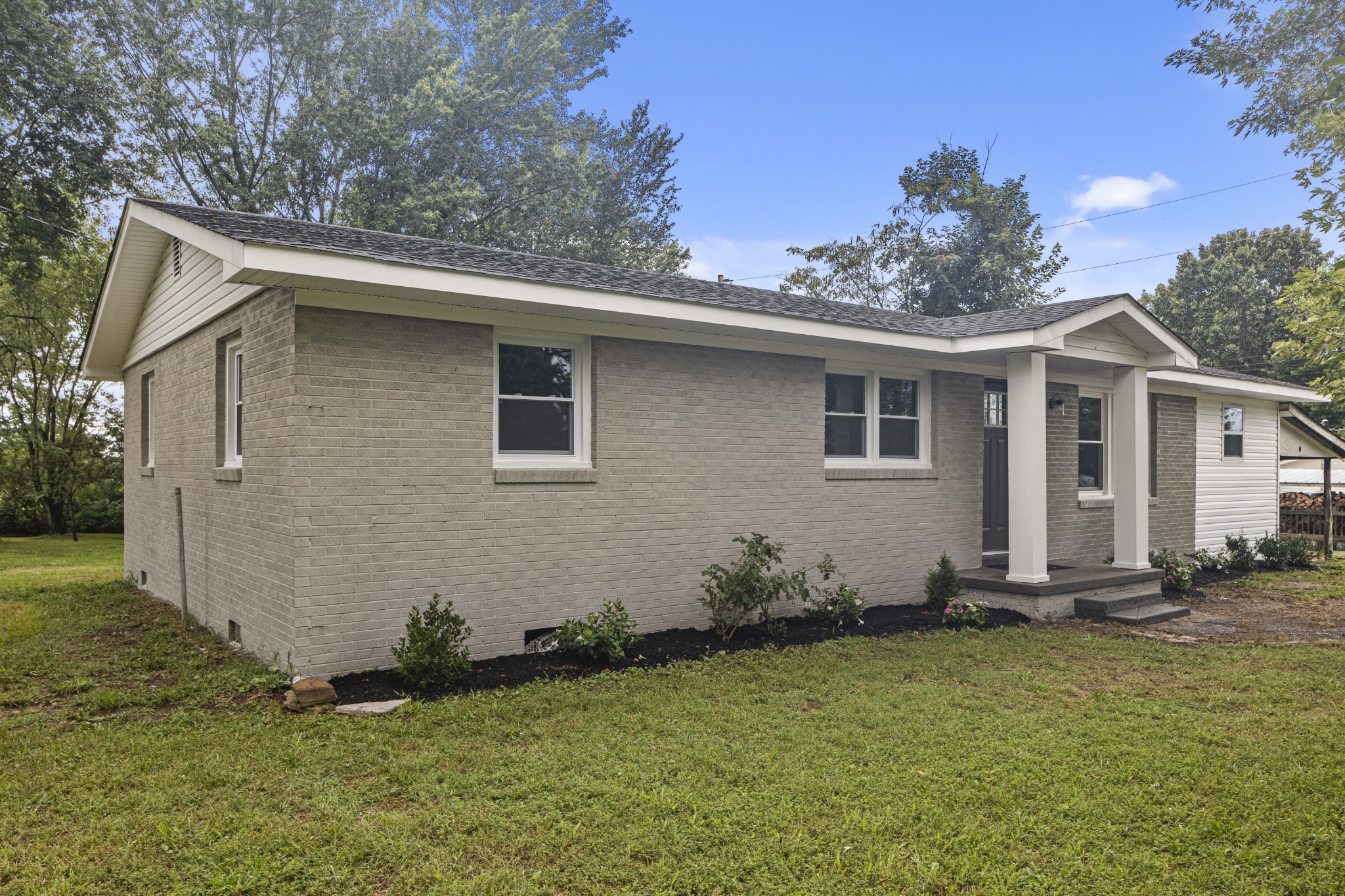 135 Hurricane Loop Tennessee Ridge, TN 37178 - Photo 23 of 29 a front view of a house with garden