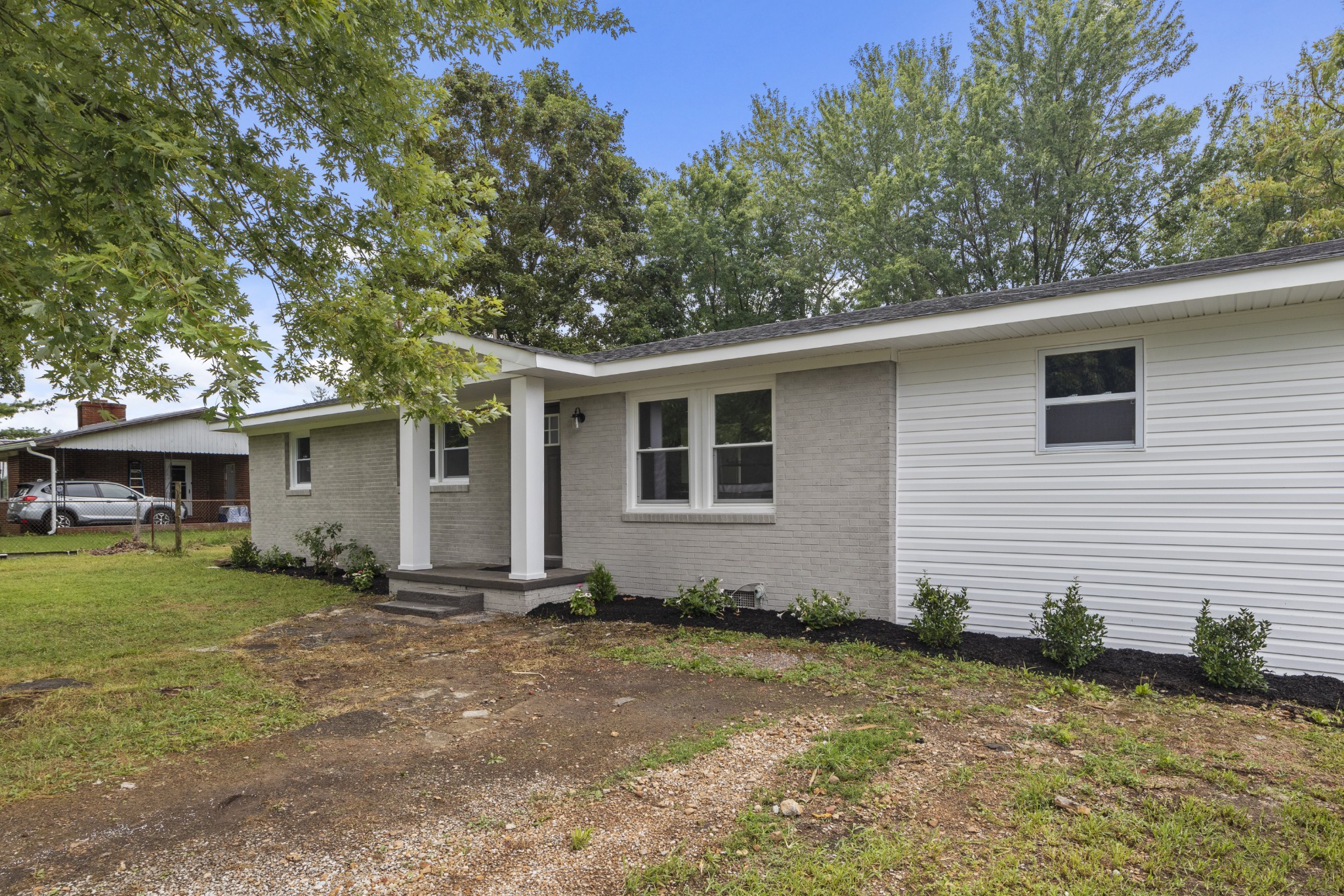 135 Hurricane Loop Tennessee Ridge, TN 37178 - Photo 24 of 29 a house with trees in the background
