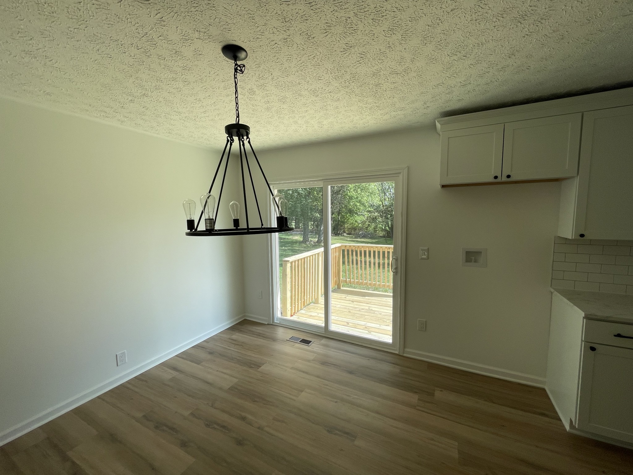 135 Hurricane Loop Tennessee Ridge, TN 37178 - Photo 29 of 29 a view of a room with wooden floor and a ceiling fan
