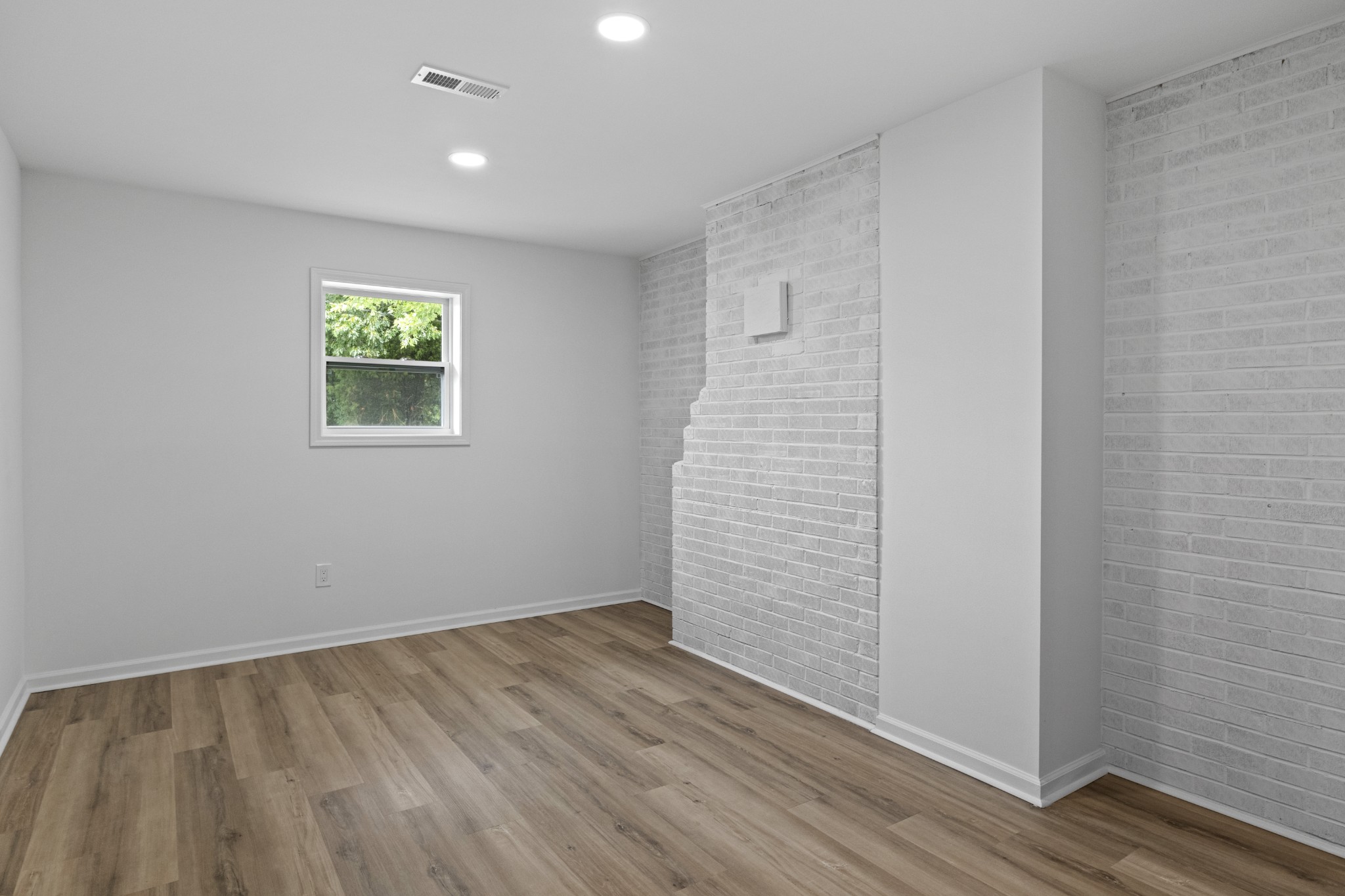 135 Hurricane Loop Tennessee Ridge, TN 37178 - Photo 10 of 29 wooden floor in an empty room with a window