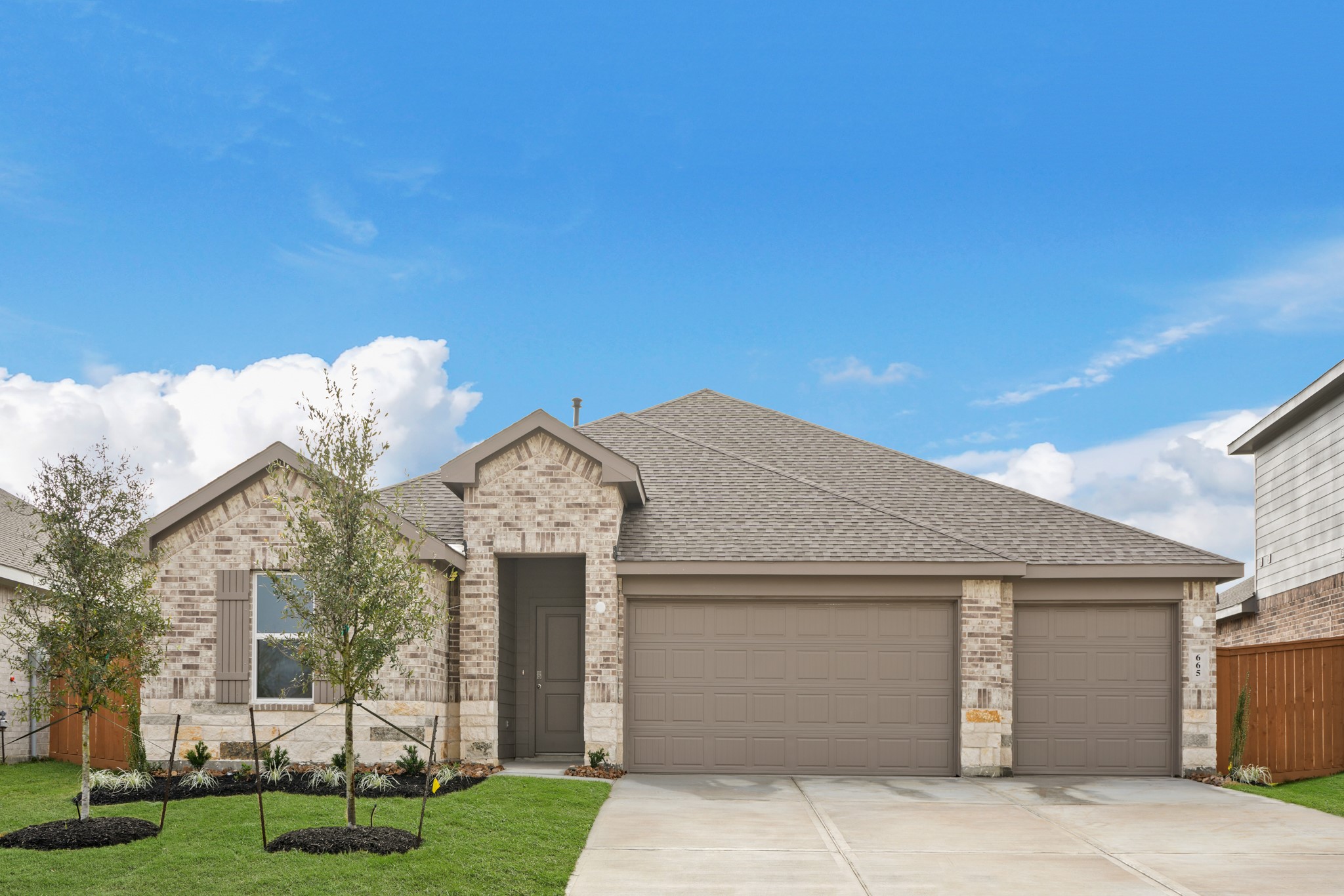 a front view of a house with a yard