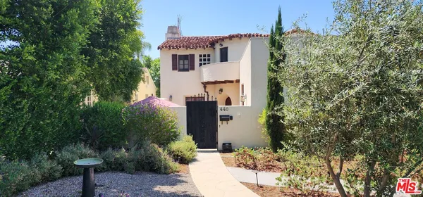 a house with trees in front of it