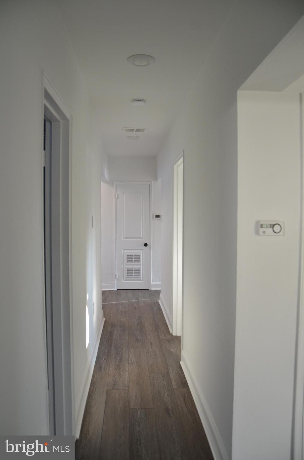 945 Croton Road Wayne, PA 19087 - Photo 12 of 13 a view of a hallway with wooden floor