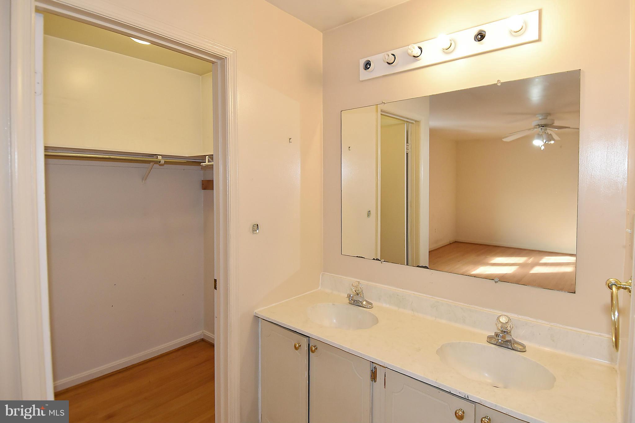 7415 Churchill Road McLean, VA 22101 - Photo 17 of 28 Master Bath and Walk-In Closet