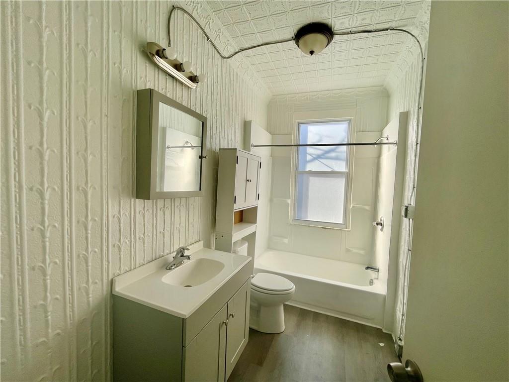 1104 Brabec Street Pittsburgh, PA 15212 - Photo 13 of 26 a bathroom with a sink a toilet and shower