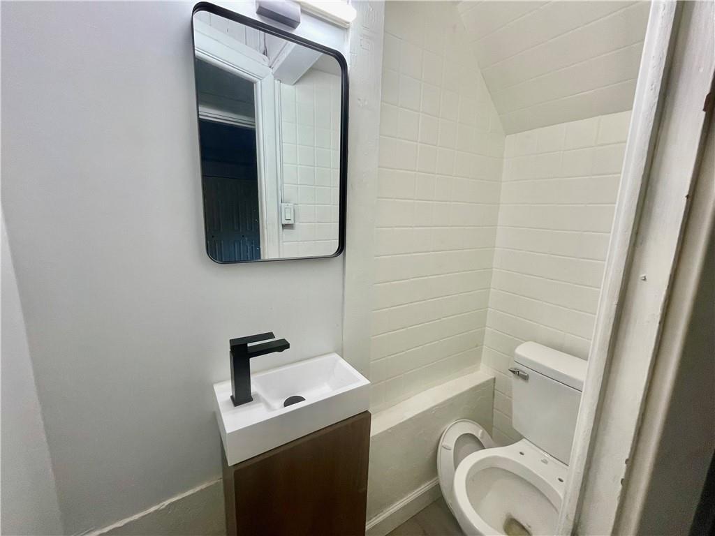 1104 Brabec Street Pittsburgh, PA 15212 - Photo 22 of 26 a bathroom with a sink toilet and shower