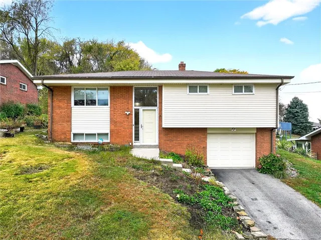 a front view of house with yard