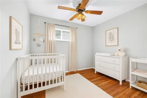 a view of hallway with wooden floor