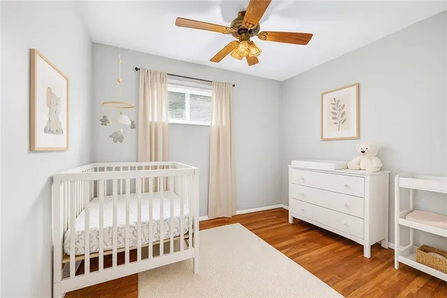 a view of hallway with wooden floor
