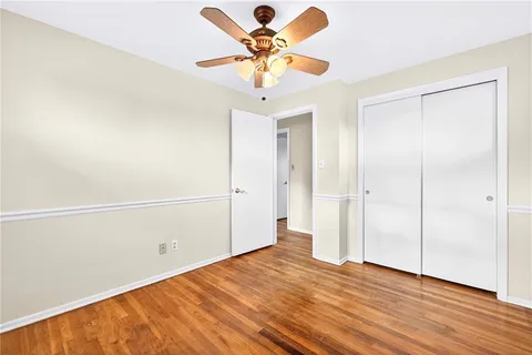 a spacious bedroom with a bed and a window