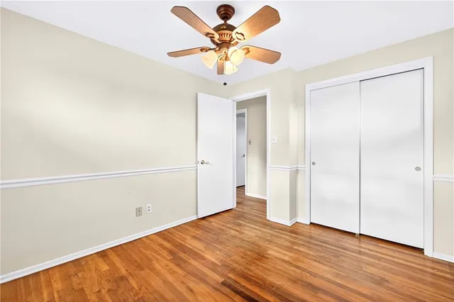 a spacious bedroom with a bed and a window