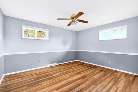 a view of room with window and ceiling fan