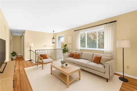 a living room with furniture and a table