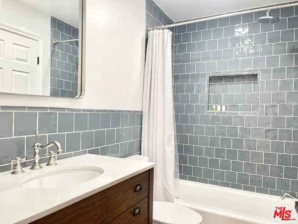 a bathroom with a sink and a bathtub