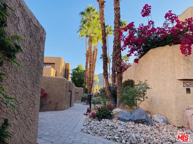 a view of a lake with houses in the back
