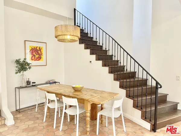 a view of a dining room with wooden floor