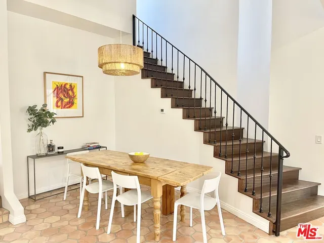 a view of a dining room with wooden floor