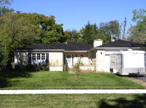 947 East Hillside Road Naperville, IL 60540 - Photo 1 of 1 front view of a house with a yard