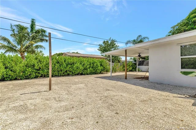 a house with a yard and plant in front of it
