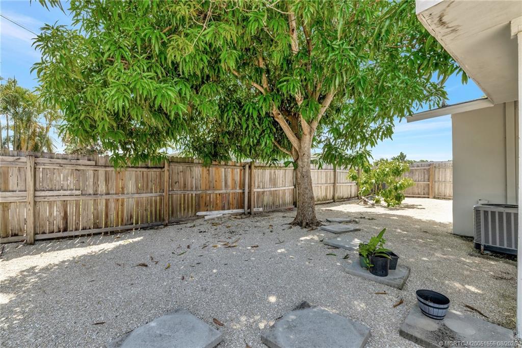 1894 Southeast Lafayette Street Stuart, FL 34997 - Photo 15 of 32 a view of a backyard with wooden fence