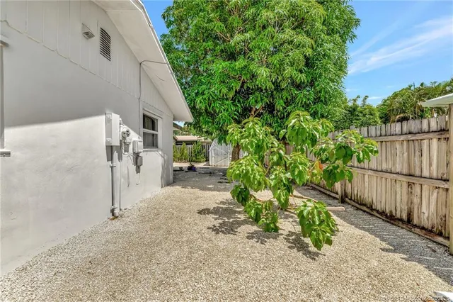 a view of a backyard with pathway