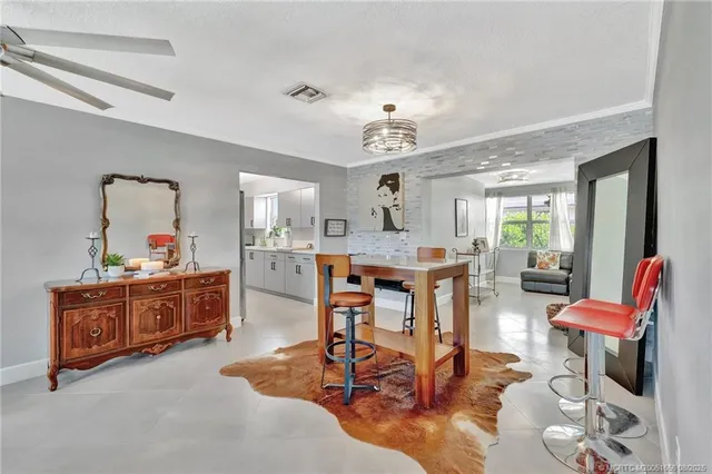 a large kitchen with a table and chairs in it