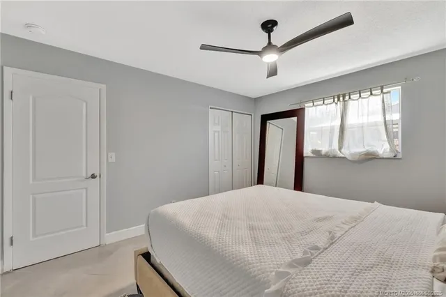 a large white bed in a white room