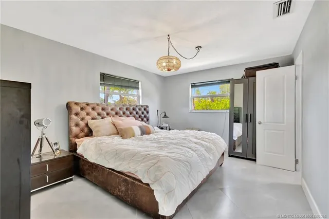 a bedroom with a bed and dresser