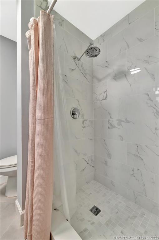 1894 Southeast Lafayette Street Stuart, FL 34997 - Photo 8 of 32 a bathroom with a shower and a toilet