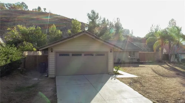 an aerial view of a house with outdoor space