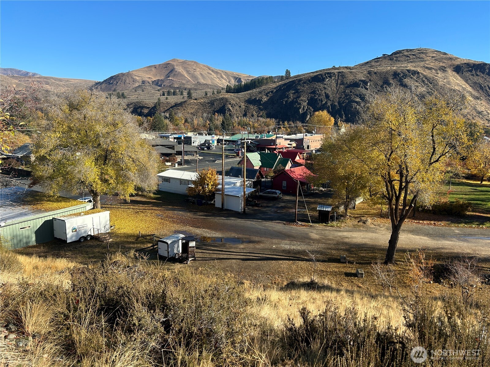 a view of swimming pool with a garden and mountain view