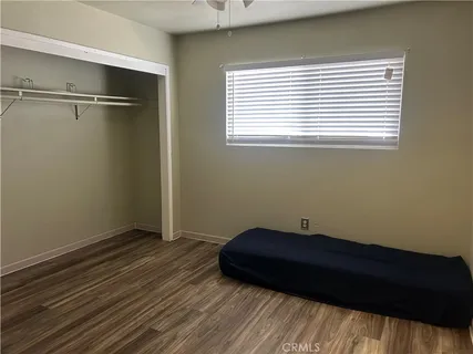 a room with a bed and a window