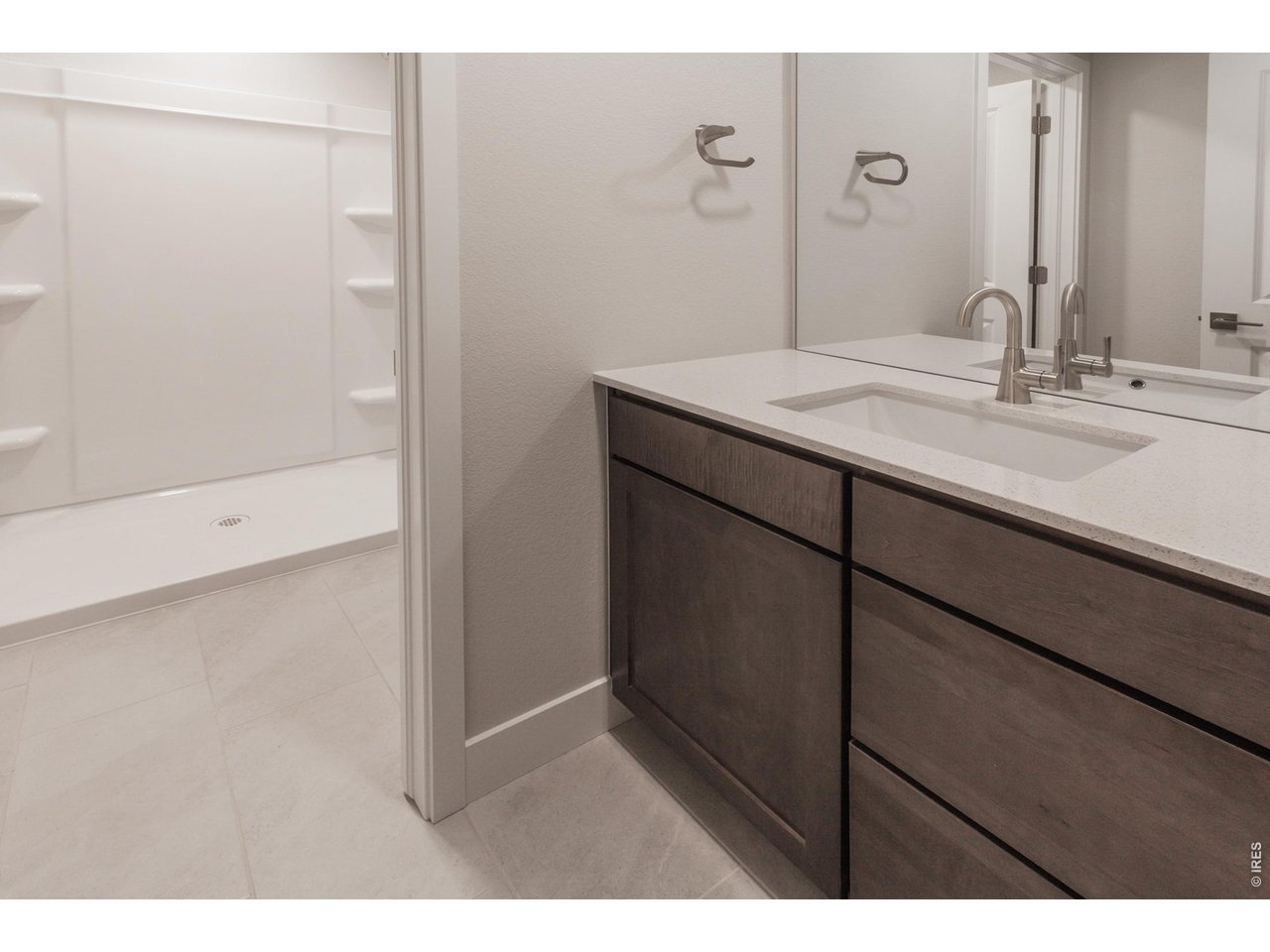 792 Chatter Road Windsor, CO 80550 - Photo 36 of 49 a bathroom with a sink and a mirror