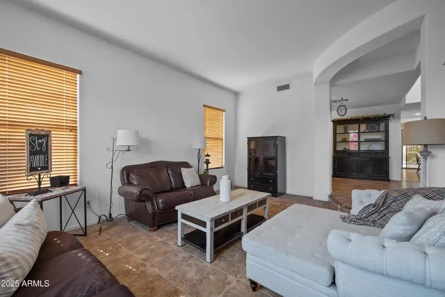 a view of a dining room with furniture wooden floor and chandelier