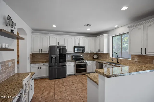 a view of a livingroom with furniture and window