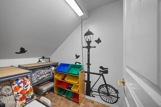 a view of a hallway with a livingroom and entryway